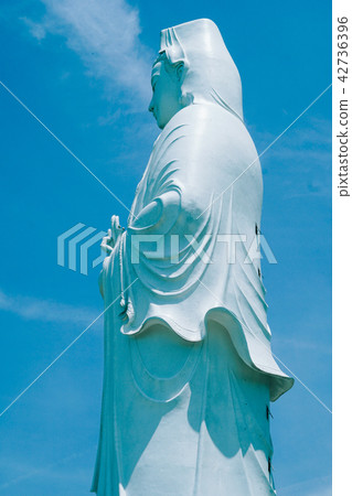 Bodhisattva statue in sky background 42736396