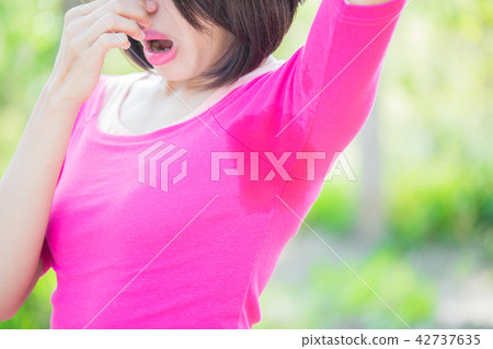 woman with body odor problem woman with body odor problem 42737635