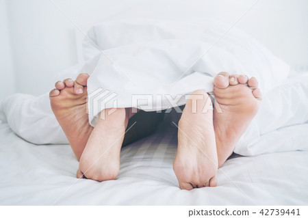 Romantic love of young couple in the bedroom. Romantic love of young couple in the bedroom. 42739441
