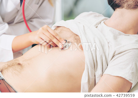 Woman Doctor and Male Patient in Hospital Office 42739559