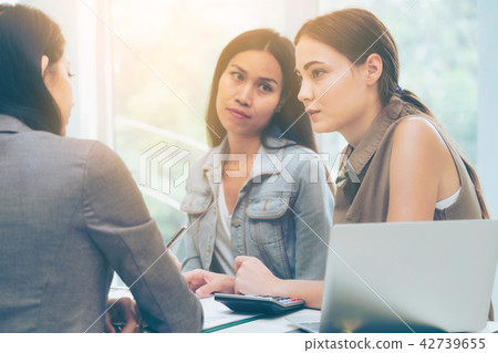 Multicultural businesswomen in group meeting. 42739655
