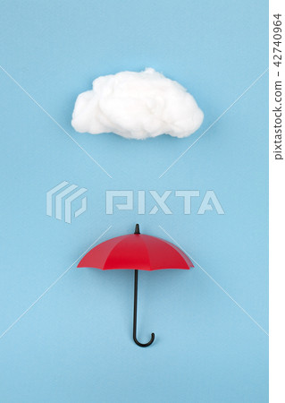 Clouds and umbrella on a blue background 42740964