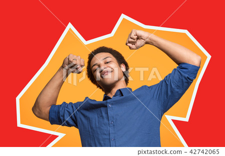Winning success man happy ecstatic celebrating being a winner. Dynamic energetic image of male model 42742065