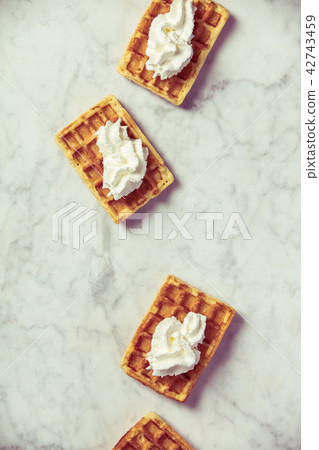 Traditional belgian waffles with whipped cream Traditional belgian waffles with whipped cream 42743459