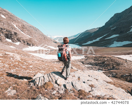 One person backpacker looking at view One person backpacker looking at view 42744078