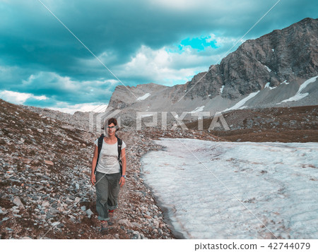 One person backpacker looking at view One person backpacker looking at view 42744079