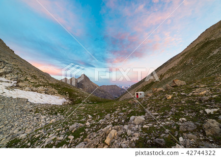 The Alps at sunrise. Colorful sky majestic peaks The Alps at sunrise. Colorful sky majestic peaks 42744322