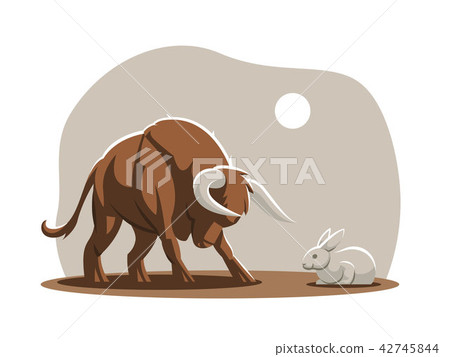 A young bull, a calf is attacking a rabbit. A young bull, a calf is attacking a rabbit. 42745844