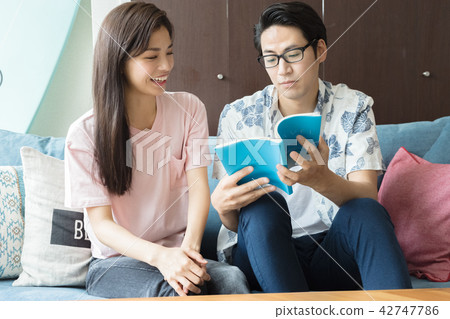 Male and female planning a trip Male and female planning a trip 42747786