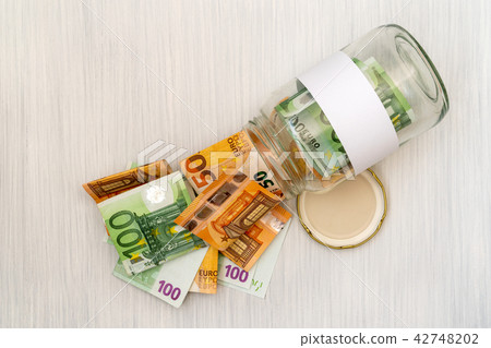 Money jar with blank label Money jar with blank label 42748202