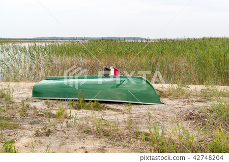 Fishing boat turned upside down Fishing boat turned upside down 42748204