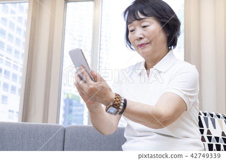 Senior female smartphone 42749339