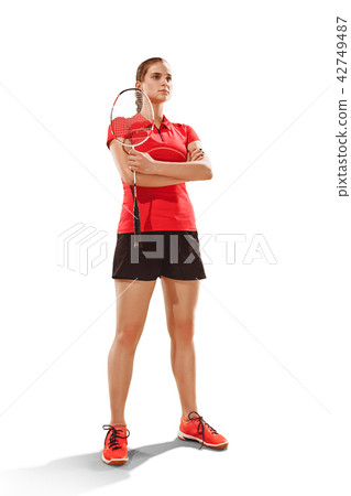 Young woman badminton player standing over white background Young woman badminton player standing over white background 42749487