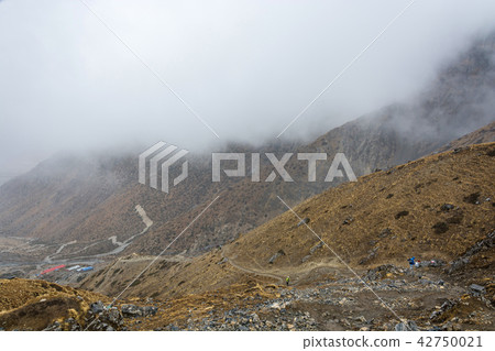 Tourists on the trail around Annapurna, Nepal. Tourists on the trail around Annapurna, Nepal. 42750021