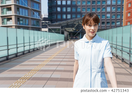 Nurse walking outside Nurse walking outside 42751343
