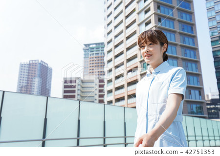 Nurse walking outside Nurse walking outside 42751353