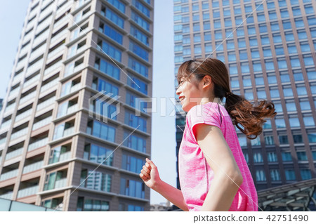 A woman running in the city 42751490
