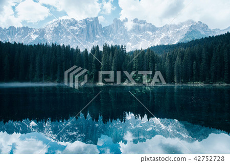 The Karersee lake with reflection of mountains in the Dolomites. 42752728
