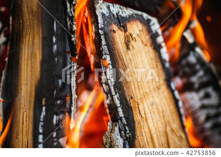 hot charred firewood in a fire 42753856