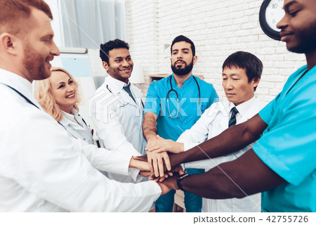 Professional Doctors Holding Each Other Hands. 42755726