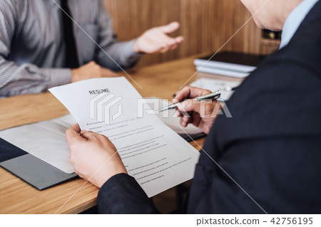 Business man explaining about his profile to two senior manager Business man explaining about his profile to two senior manager 42756195