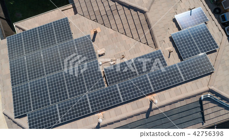 Solar Panels Installed on Roof of Large House Solar Panels Installed on Roof of Large House 42756398