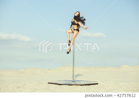 Woman dances sex dance in the desert. Woman dances sex dance in the desert. 42757612