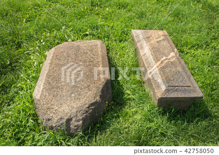 Old tombstones on green grass Old tombstones on green grass 42758050