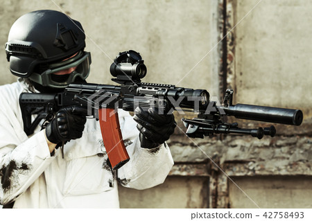 man aiming with an AK-47 man aiming with an AK-47 42758493