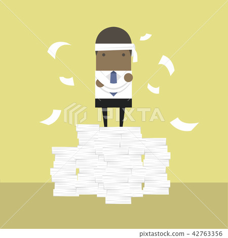 African businessman standing on paperwork. 42763356