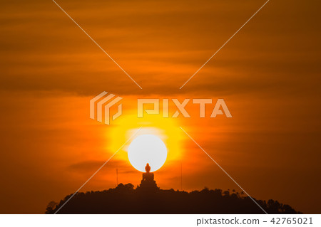 round red sunset on the back of Phuket big Buddha round red sunset on the back of Phuket big Buddha 42765021