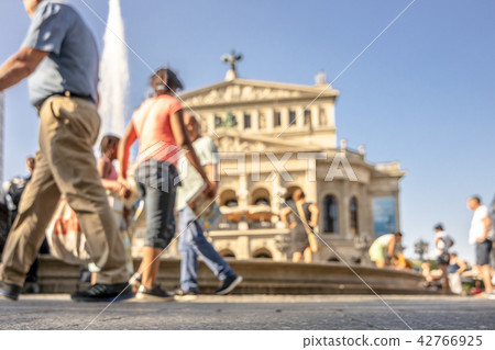 Blurry shot of people walking on the Opernplatz in Frankfurt Germany and looking for refreshment in Blurry shot of people walking on the Opernplatz in Frankfurt Germany and looking for refreshment in 42766925