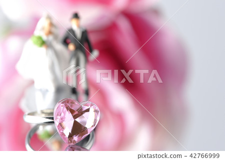 Flower and ring and bride and groom 42766999