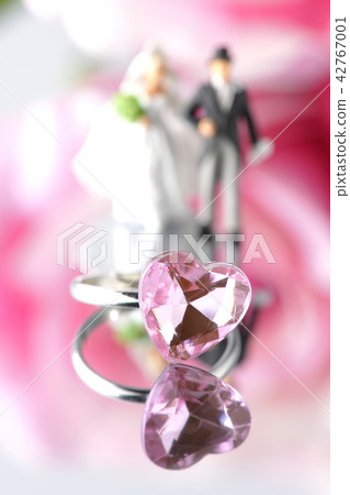 Flower and ring and bride and groom Flower and ring and bride and groom 42767001
