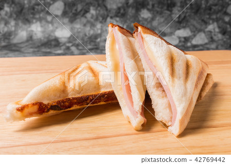 Bread toast made to sandwich with ham and cheese. Bread toast made to sandwich with ham and cheese. 42769442