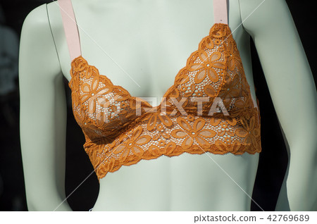 orange bra on mannequin in fashion store  42769689
