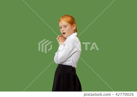 Portrait of the scared teen girl on green Portrait of the scared teen girl on green 42770026