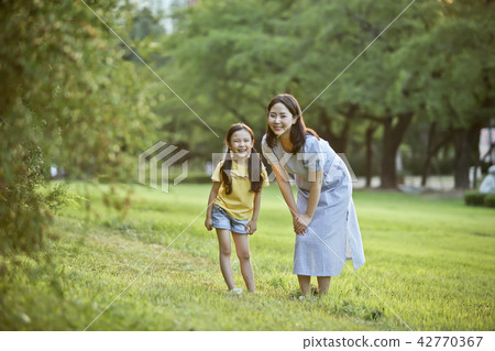 Mother and child talking on the lawn Mother and child talking on the lawn 42770367