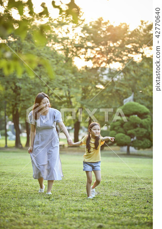 Mother and Child, Lawn, and Conversation Mother and Child, Lawn, and Conversation 42770640