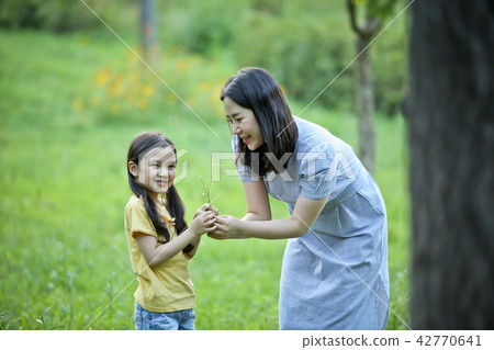 Mother and Child, Lawn, and Conversation Mother and Child, Lawn, and Conversation 42770641