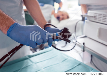 Internist doctors during stomach examination  42771066