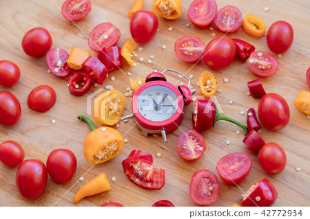 peppers, tomatoes with alarm clock peppers, tomatoes with alarm clock 42772934