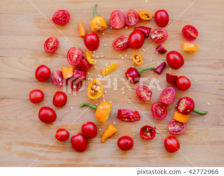 cut chilli peppers and tomatoes 42772966