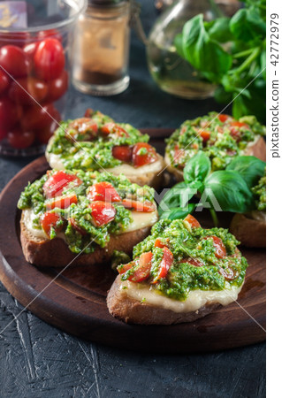 Bruschetta with fresh pesto 42772979