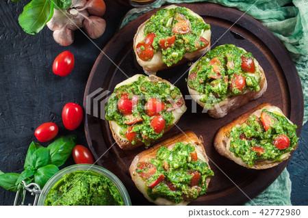 Bruschetta with fresh pesto 42772980
