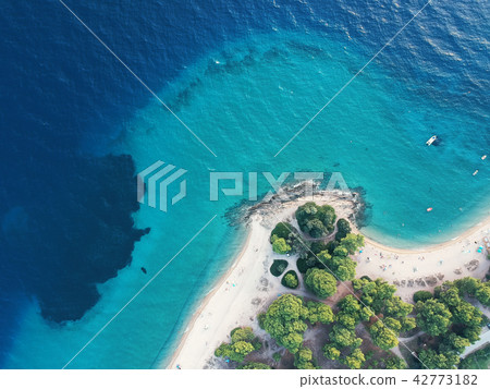Aerial view of bright turqoise water and beach Aerial view of bright turqoise water and beach 42773182