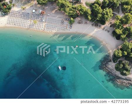 Aerial view of bright turqoise water and beach Aerial view of bright turqoise water and beach 42773195