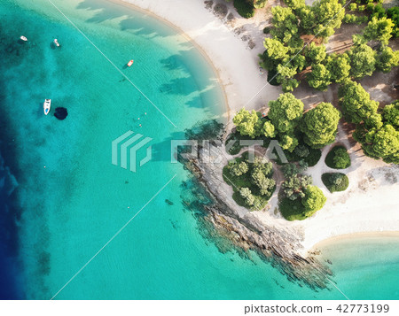 Aerial view of bright turqoise water and beach Aerial view of bright turqoise water and beach 42773199
