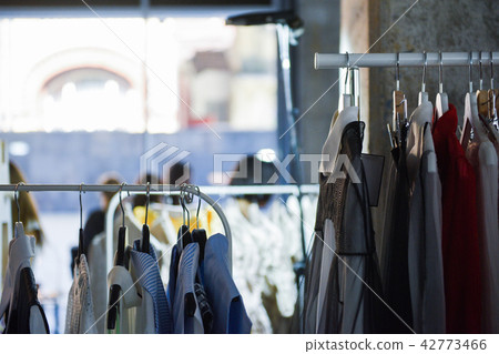 Women clothing on hangers in a boutique store Women clothing on hangers in a boutique store 42773466