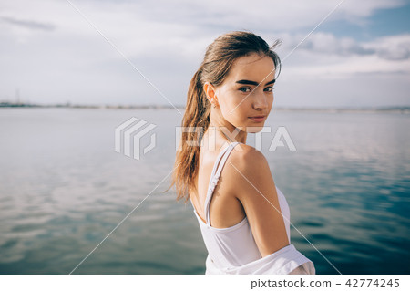 Portrait of cute young woman with thick eyebrows 42774245